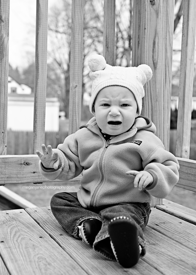 Lila sitting on the deck, upset; taken by MA children's photographer Megan Moore.